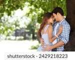 Love, hug and happy with couple in park for romance, bonding and summer vacation. Happiness, commitment and relax with man and woman embrace on date in nature for funny, support and relationship