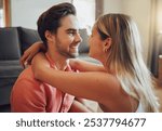 Love, hug and happy couple relax in home for care, bonding together and communication with partner. Living room, man and woman embrace for romantic relationship, eye contact or connection for loyalty