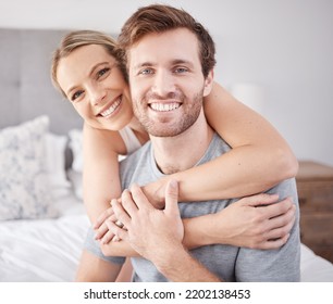 Love, Hug And Portrait Of Couple In Bedroom Relax, Bonding And Enjoy Quality Time Together In Hotel Room Suite. Peace, Smile And Calm Quiet Morning For Happy Young Man And Woman On Holiday Vacation