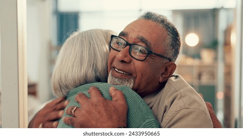 Love, hug and senior couple in home, together and support, trust or care during retirement. Diversity, smile and happy with elderly man, woman and embracing for romance in their house for wellness - Powered by Shutterstock