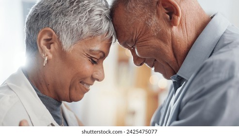 Love, hug and senior couple in their home for support, happy together and affection with laugh or smile. Elderly woman and man with eyes closed for prayer in marriage, mindfulness and romance or care - Powered by Shutterstock