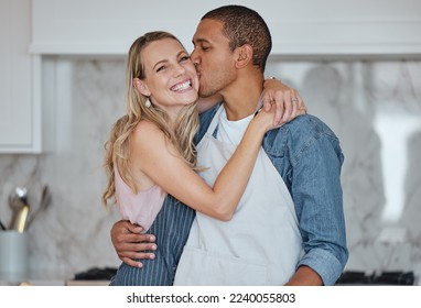 Love, interracial and couple kiss in kitchen, happiness and loving together for relationship. Romance, man and woman with embrace, kissing and celebrate for anniversary, cooking and relax with hug. - Shutterstock ID 2240055803