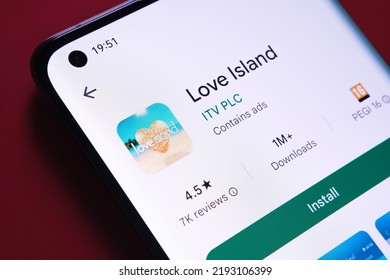 Love Island App Seen In Google Play Store On The Smartphone Screen Placed On Red Background. Close Up Photo With Selective Focus. Stafford, United Kingdom, August 2, 2022.