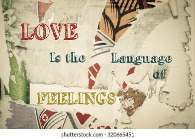 Love Is The Language Of Feelings - Inspirational Message Written On Vintage Grunge Background With Old Torn Posters. Motivational Concept Image