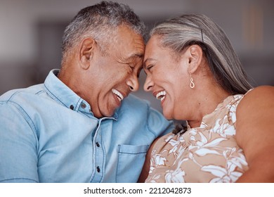 Love, Laugh And Happy Elderly Couple Relax And Bond In A Living Room, Laughing And Sharing A Funny Joke In Their Home Together. Family, Humour And Senior Man And Woman Embrace And Enjoy Retirement