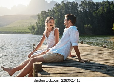 Love, laugh and pier with couple at lake for bonding, romance and affectionate date. Nature, travel and holiday with man and woman sitting on boardwalk in countryside for happy, summer and vacation - Shutterstock ID 2280020415