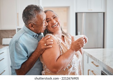 Love, laughing and elderly couple embrace in kitchen, having fun, talking and being silly together. Happy family, relax and retirement by senior man and woman enjoy conversation and relaxed lifestyle