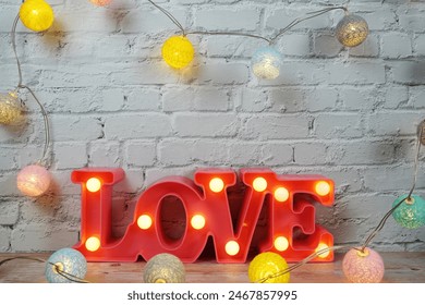 Love LED sign decorative letters for Valentine's day on white brick wall background - Powered by Shutterstock