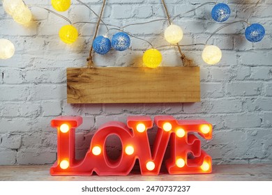 Love LED sign decorative letters for Valentine's day on white brick wall background - Powered by Shutterstock