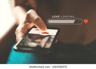 Love loading progress, Finger of woman pushing heart icon on screen in mobile smartphone application. Online dating app, valentine's day concept. Mockup website.