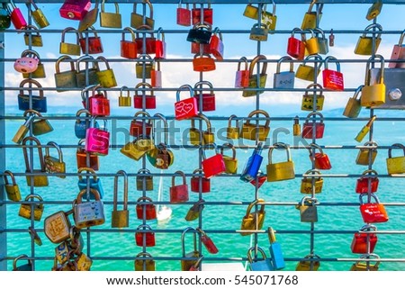 Love locks hanging on a lookout tower in friedrichshafen, germany.