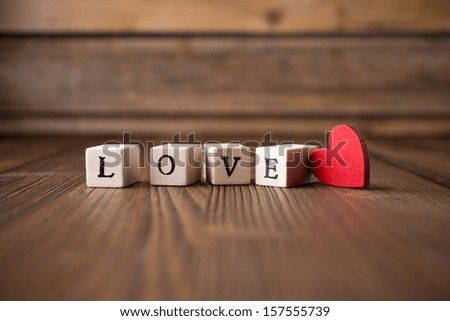 Similar – Image, Stock Photo The word Love on glittering soft pink fabric