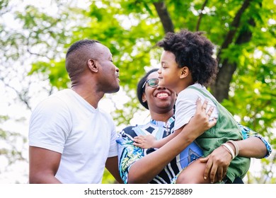 Love Moment Of Happy African American Family In The Park In Springtime