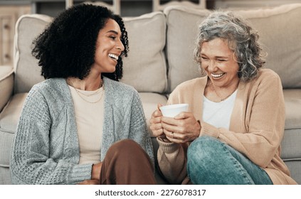 Love, mother and adult daughter on floor, coffee and conversation with happiness, break and laughing. Family, mama and female grown child on ground, tea and smile with rest, funny and quality time - Powered by Shutterstock