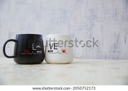 Love mug cup white backgrounds . White and black colored cup I love you . Mr. Handsome Mrs. Beautiful couple mug . Picture of heart and pulse . Azerbaijan Baku . 25.04.2021 .