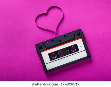 Love Music Concept Retro Audio Tape Cassette Isolated On Pink Background, Pop Art Design, Close Up