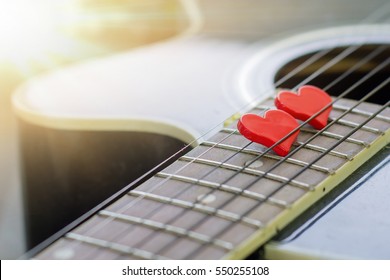 love music. red heart on a black acoustic guitar - Shutterstock ID 550255108
