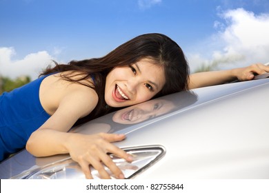 I Love My New Car. Beautiful Young Woman Holding Her Car