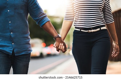 Love, Never Let It Go. Cropped Shot Of An Affectionate Couple Holding Hands Outdoors.