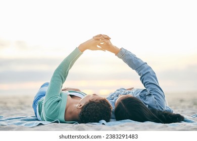 Love, ocean and lesbian couple on blanket holding hands on sand, summer and sunset holiday adventure. Lgbt women, bonding and relax on beach picnic date with romance, pride and happy lying in nature. - Powered by Shutterstock