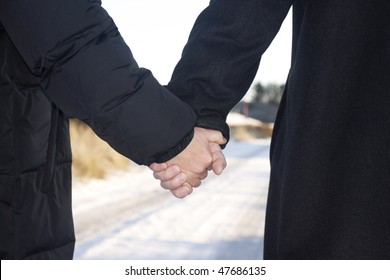 Love - Older Couple Holding Hands  Taking A Walk Outside