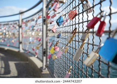 Love Padlocks on a Fence in Konstanz, Germany. Symbol of Love lasting forever.  - Powered by Shutterstock