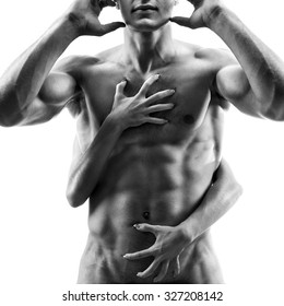 Love, passion, sexuality, man and woman, relationships - athletic body men which hugs the woman, passion, male torso