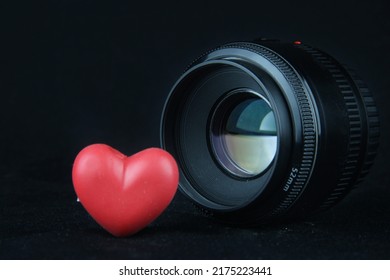 Love for photography, 50mm lens next to a red heart