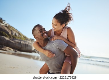 Love, piggy back and black couple on beach walking, smile and happy together, for bonding and outdoor. Romantic, man carry woman or loving on seaside vacation, holiday and romance for relationship. - Powered by Shutterstock