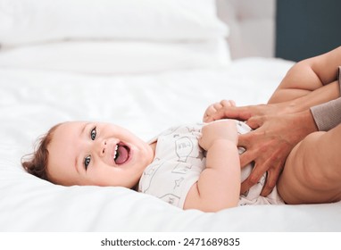 Love, portrait and happy baby with mother on a bed for fun, bonding and playing tickle games in their home together. Smile, face and excited kid with parent in a bedroom for comfort, care or support - Powered by Shutterstock