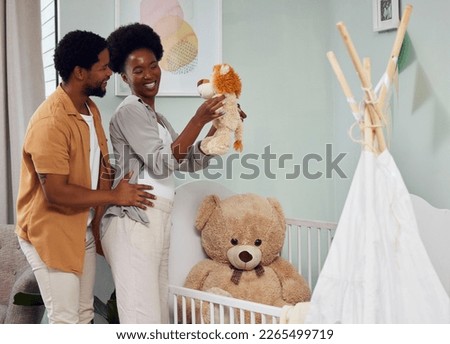 Love, pregnancy and couple with teddy bear in the nursery with excitement while preparing for their baby. Happy, smile and young African man with his pregnant wife looking at toy together in bedroom.