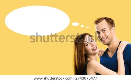 Love, relationships, togetherness, dates, affection, happiness, romance concept - happy brightly smile hug embrace man, woman, girlfriend, boyfriend. Isolated against orange yellow colour background. White thought think float bubble. Free ad copy space