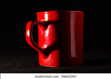 Love and romance concept on tea cup isolated on the dark background
