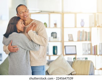 Love, romance and married with a couple hugging while standing in their home together with mockup or flare. Affection, bonding and hug with a mature man and woman embracing in their domestic house - Powered by Shutterstock