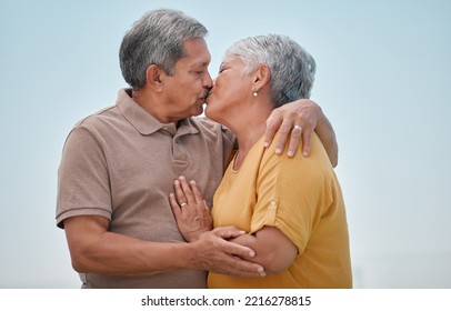 Love, Romance And Old Couple Kiss On Marriage Anniversary Holiday Vacation In Retirement Outdoors. Elderly, Trust And Senior Woman Kissing And Enjoying Romantic Quality Time With Partner In Bogota