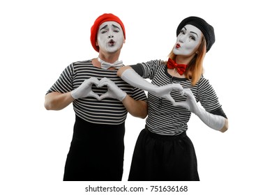 Love Scene Of Pantomime Actors. Male And Female Mime Artists Imitating Being In Romantic Mood, Showing Heart Shapes With Their Hands. Love Is In The Air.