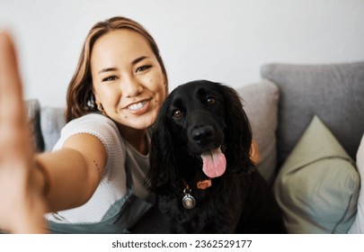 Love, selfie and woman with dog on home sofa to relax and play with animal. Pet owner, care and asian person influencer with companion, smile and friendship or social media profile picture and memory - Powered by Shutterstock
