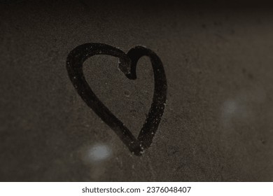 love sign on dusty glass