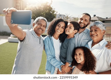 Love, smile and selfie of happy big family bonding, relax or enjoy quality time together in Rio de Janeiro Brazil. Holiday vacation, backyard photo or youth children, parents and grandparents reunion - Powered by Shutterstock