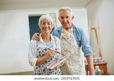 Love is the spirit that motivates the artists journey. Shot of a senior couple painting at home. - Powered by Shutterstock