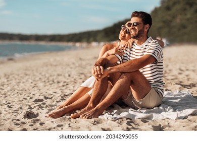 love, summer holidays and people concept - happy smiling couple chilling on beach - Powered by Shutterstock