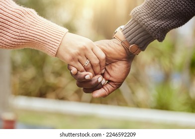 Love, support and trust hands of black couple in marriage together with care, romance and unity. Soulmate, married and man with woman holding hands for romantic bonding moment in nature zoom. - Shutterstock ID 2246592209