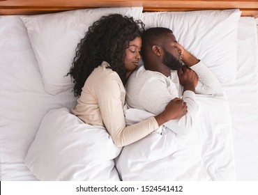 Love And Tenderness Concept. Romantic Black Couple Hugging While Sleeping In Bed, Top View