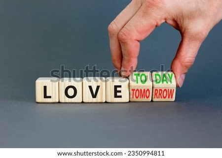 Love today not tomorrow symbol. Businessman turns wooden cubes and changes word Love tomorrow to Love today. Beautiful grey background. Business and love today not tomorrow concept. Copy space.