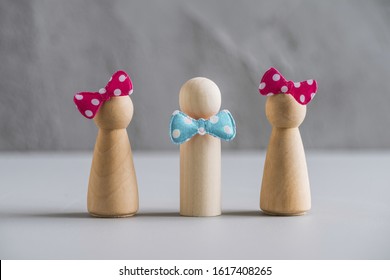 Love Triangle Concept. One Wooden Men And Two Woman. Divorce. Treason. 