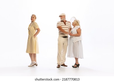 Love Triangle, Intrigue. Handsome Senior Man And Two Charming Women In Vintage Retro Style Outfits Isolated On White Background. Concept Of Relations, Family, 1960s American Fashion Style And Art.