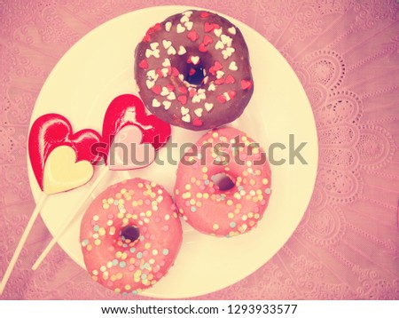 Similar – Image, Stock Photo Two red heart lollipop pattern on pink background