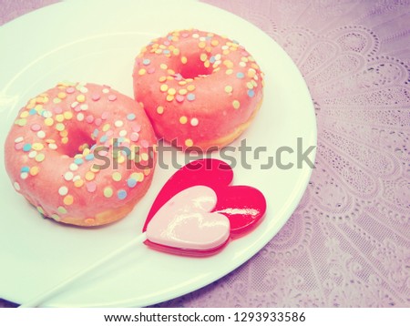 Similar – Image, Stock Photo Two red heart lollipop pattern on pink background