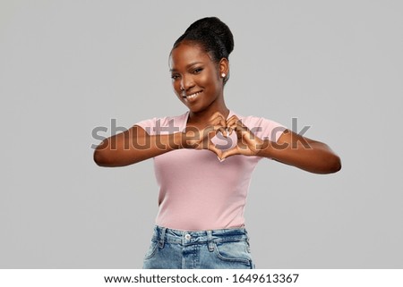 Similar – Black woman making the gesture of the horns