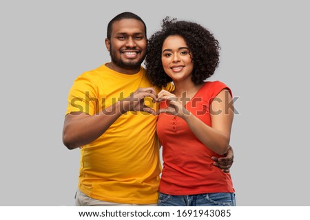 Similar – Black woman making the gesture of the horns